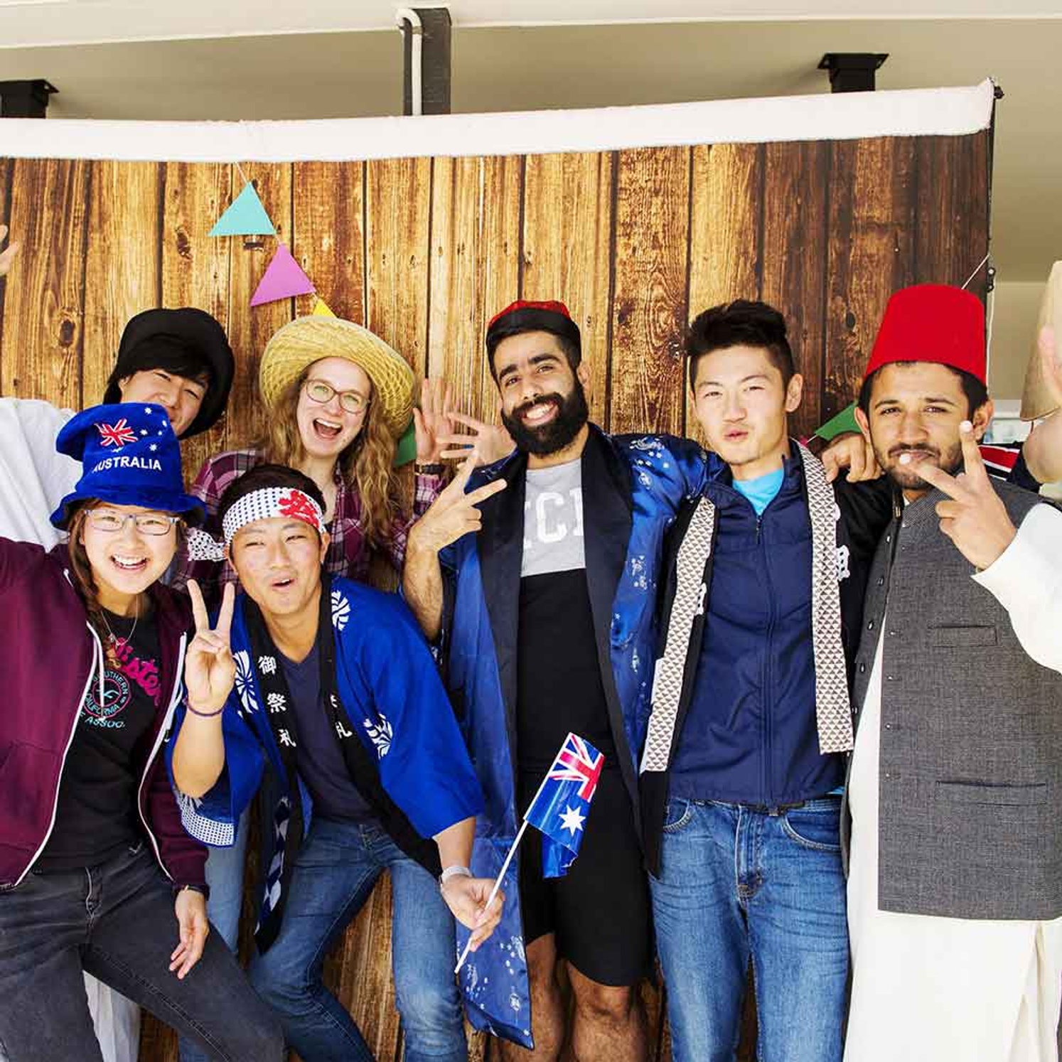 Group of International students with flags and cultural dress