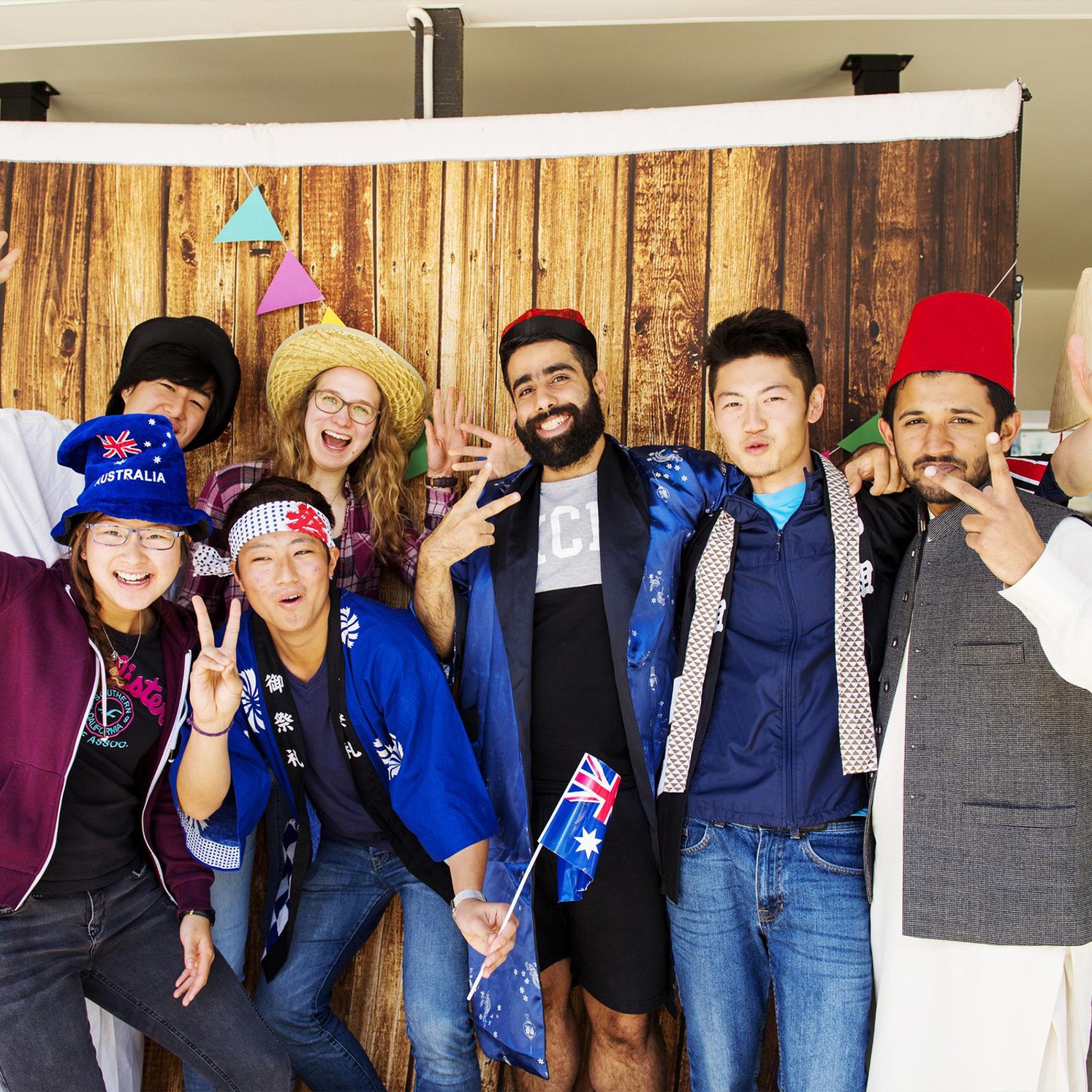 Group of International students with flags and cultural dress