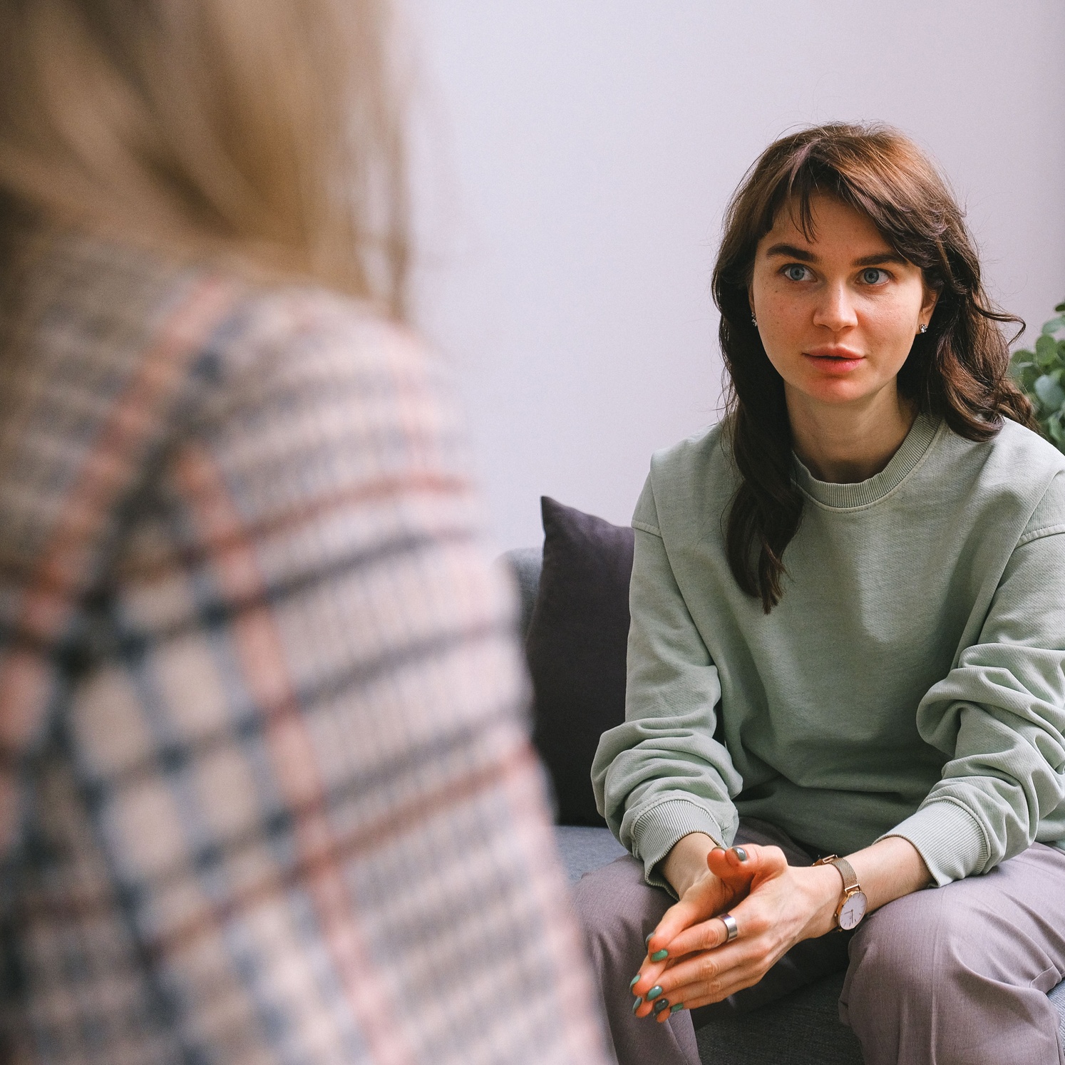 a woman speaking to a counsellor