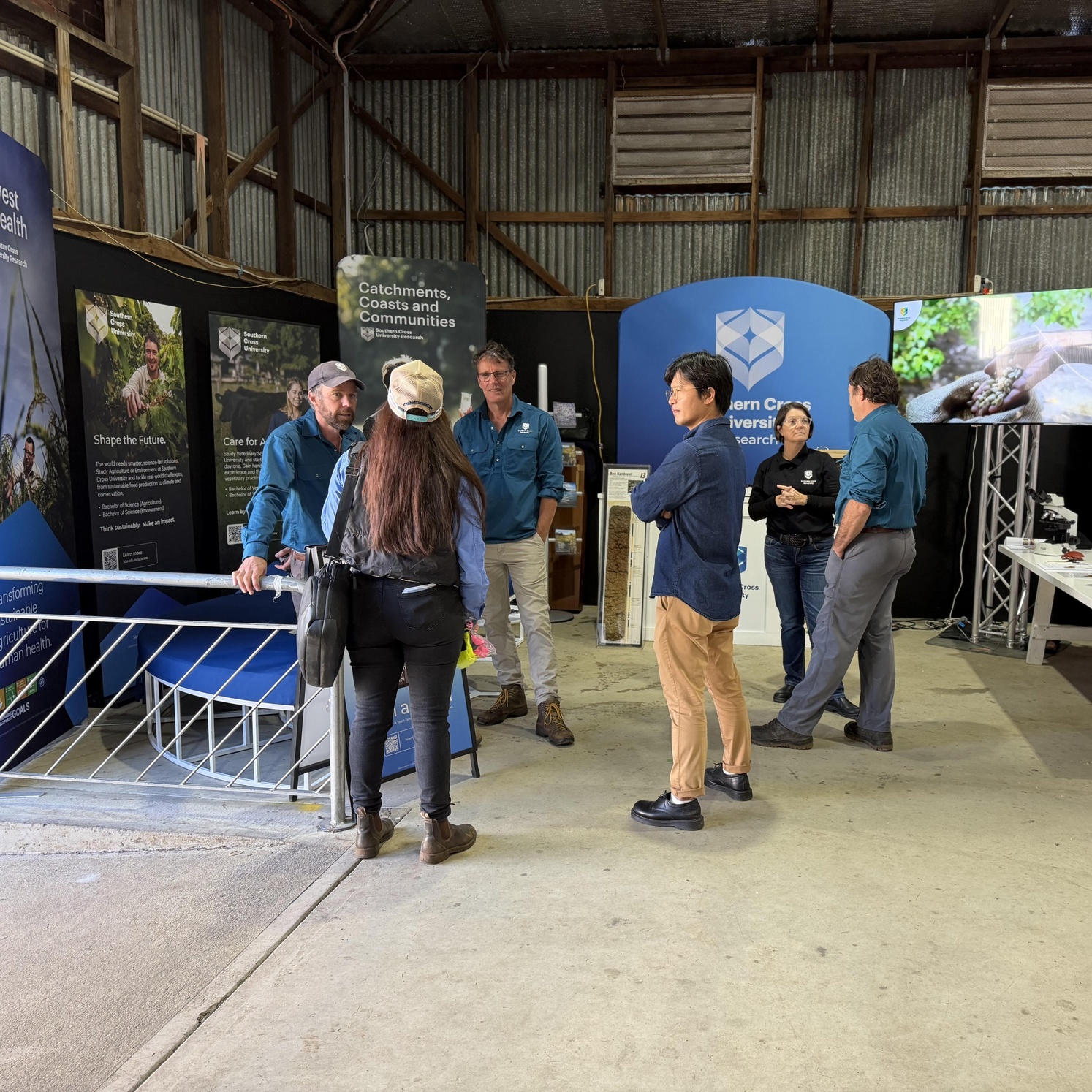 Researchers and patrons talking at 2026 PRIMEX Feild Day