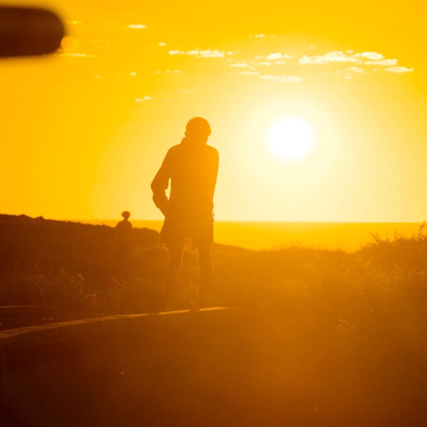 Person standing on path Sunset Coffs-Harbour