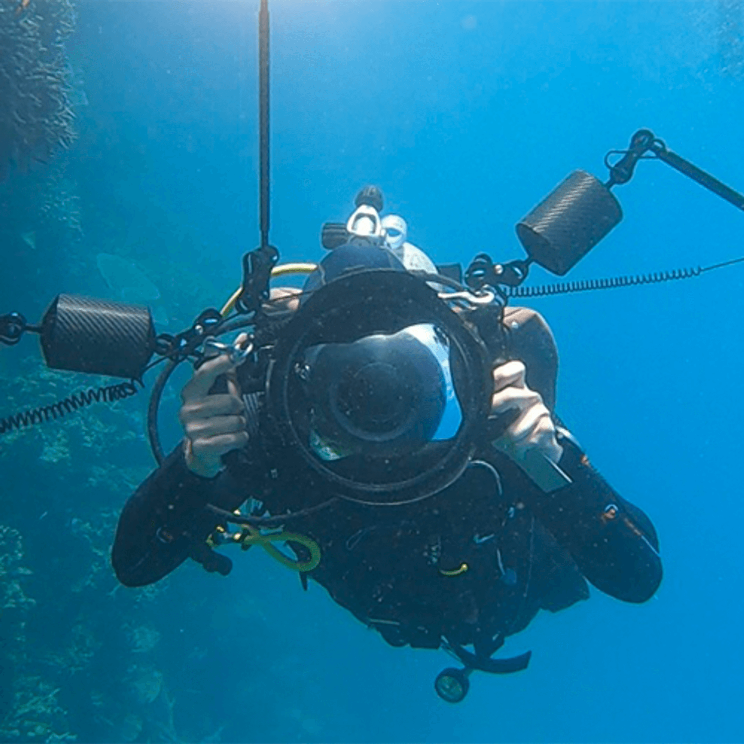 Diver underwater with camera