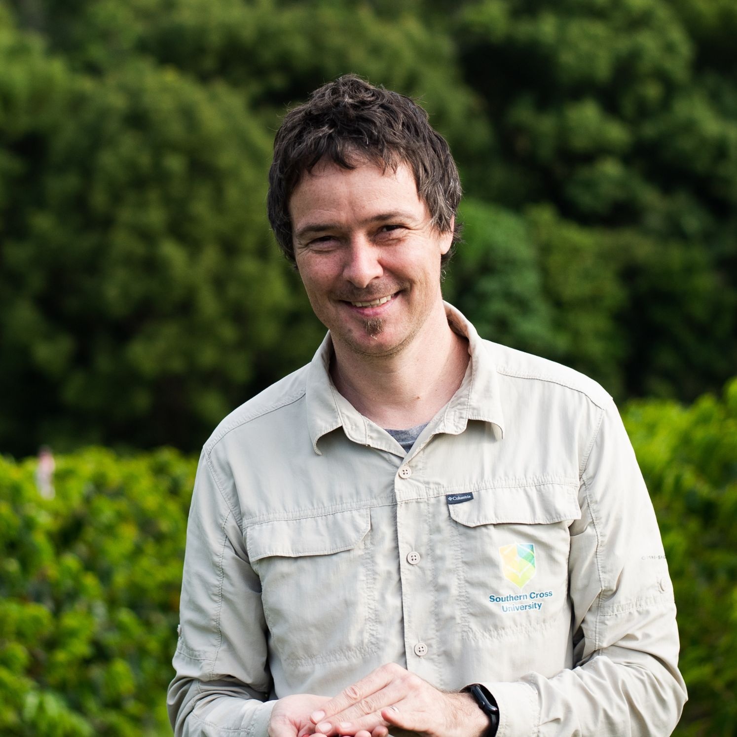 Portrait of Professor Tobias Kretschmar in front of trees