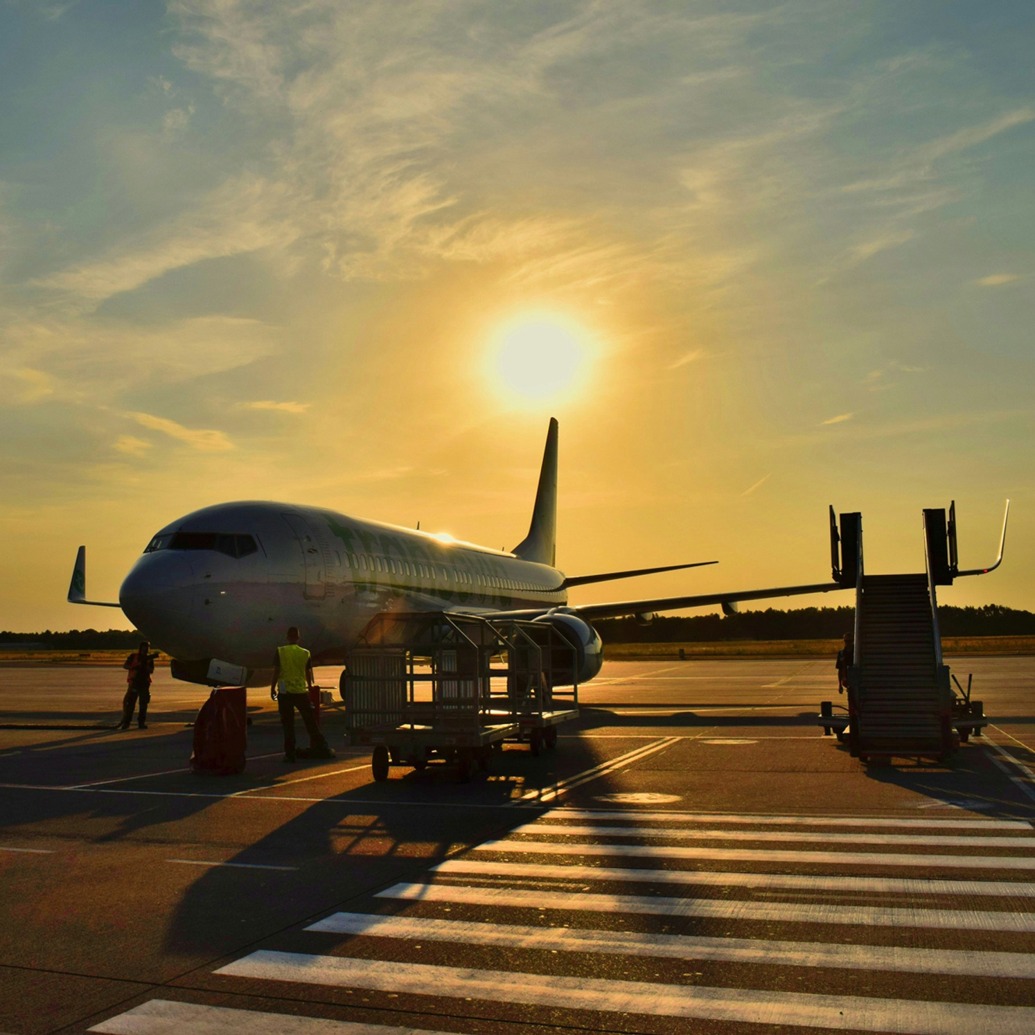 plane on tarmac in muted light at sunset