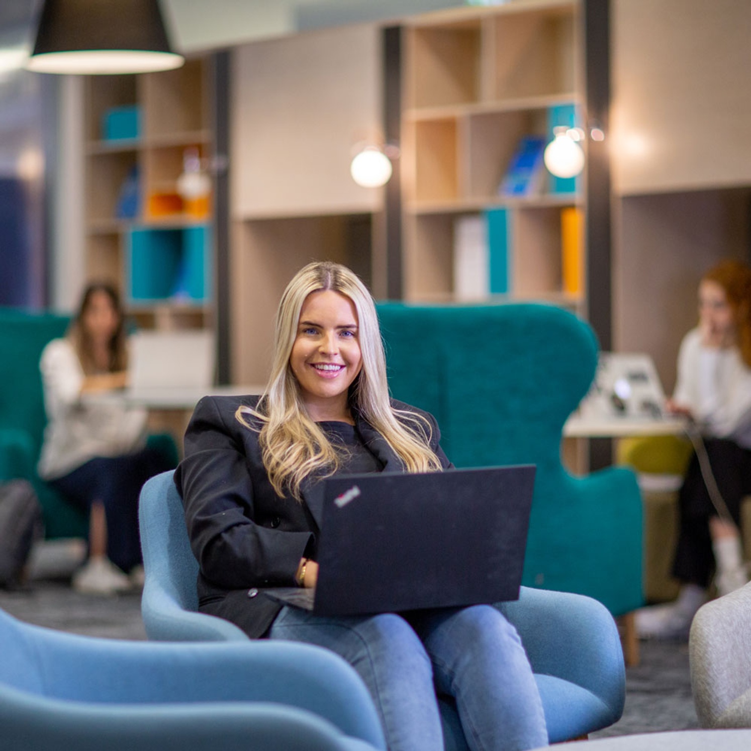 female student sitting with computer