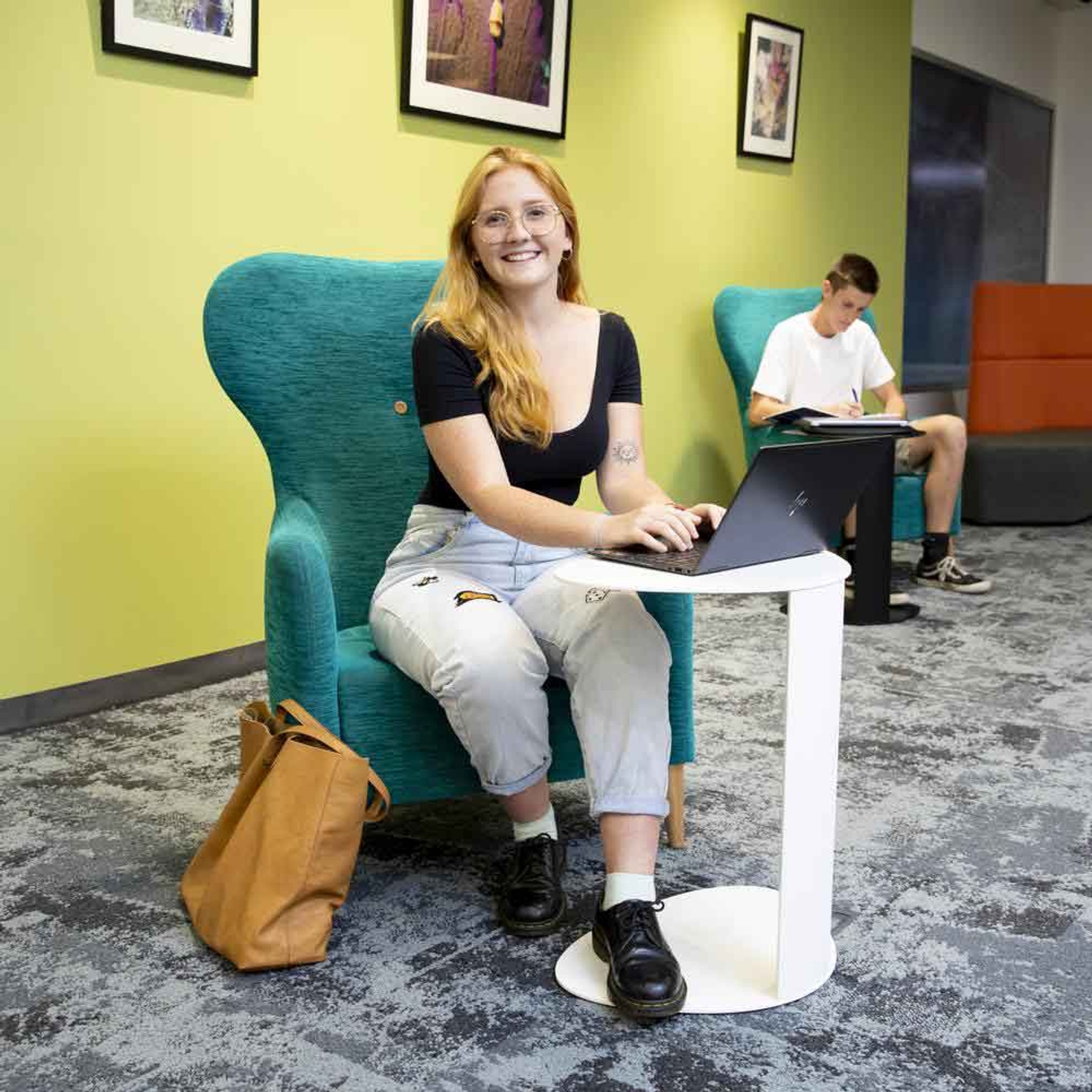 Student with laptop in the library