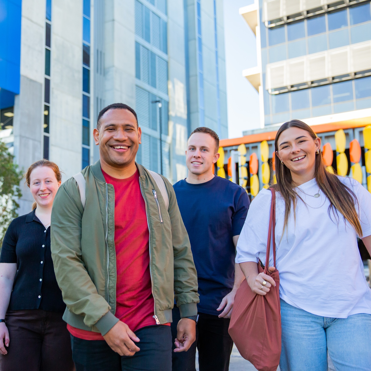 Group of students smiling on Gold Coast campus