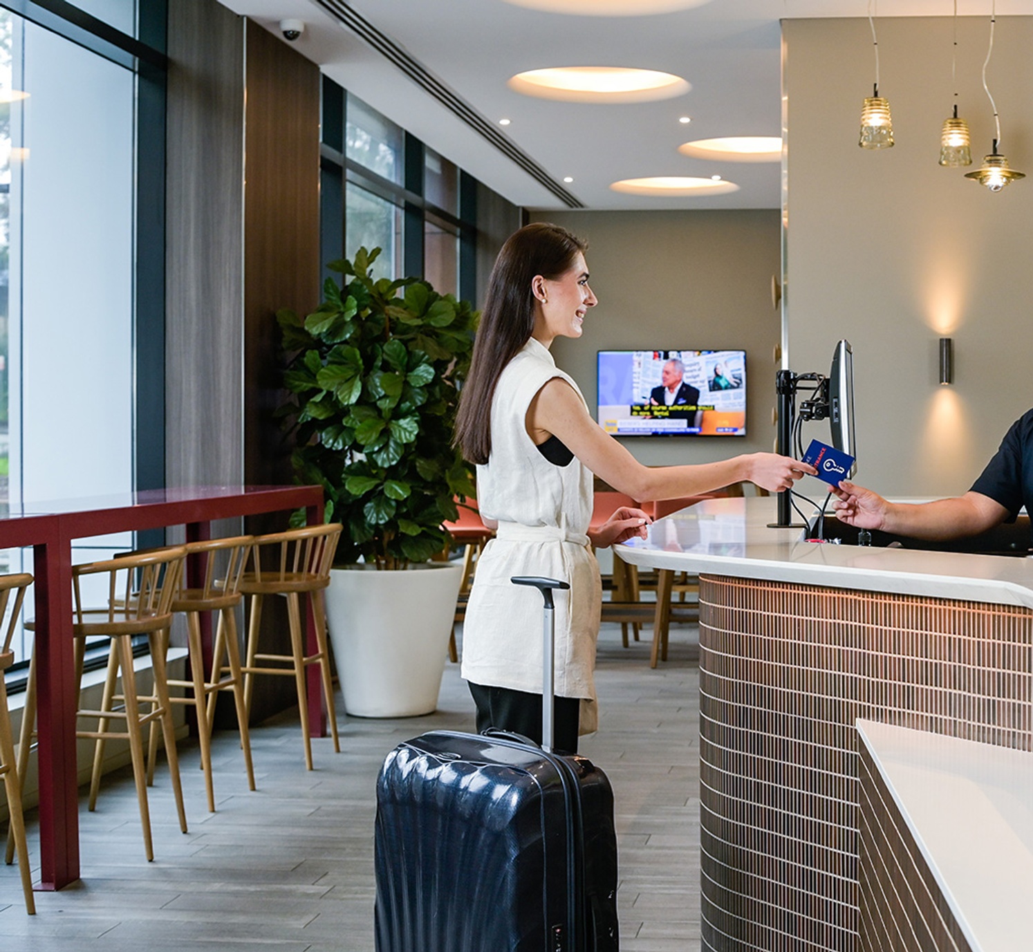 Woman at hotel counter