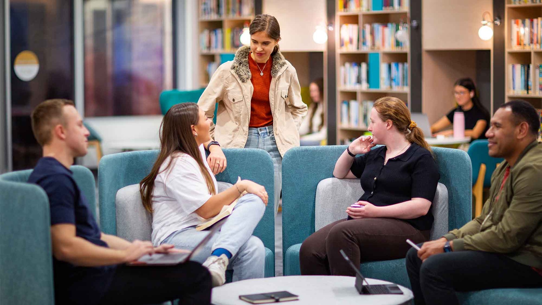 Students chatting in library