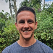 A man smiles at the camera