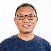 Head and shoulders of man wearing glasses