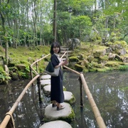 Risa Otake standing on rock bridge