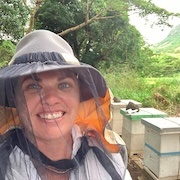 Woman in front of bees