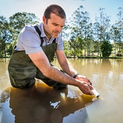 Professor Damien Maher - researcher taking water samples