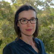 Head and shoulders of woman wearing glasses - Emma Thompson Brewster