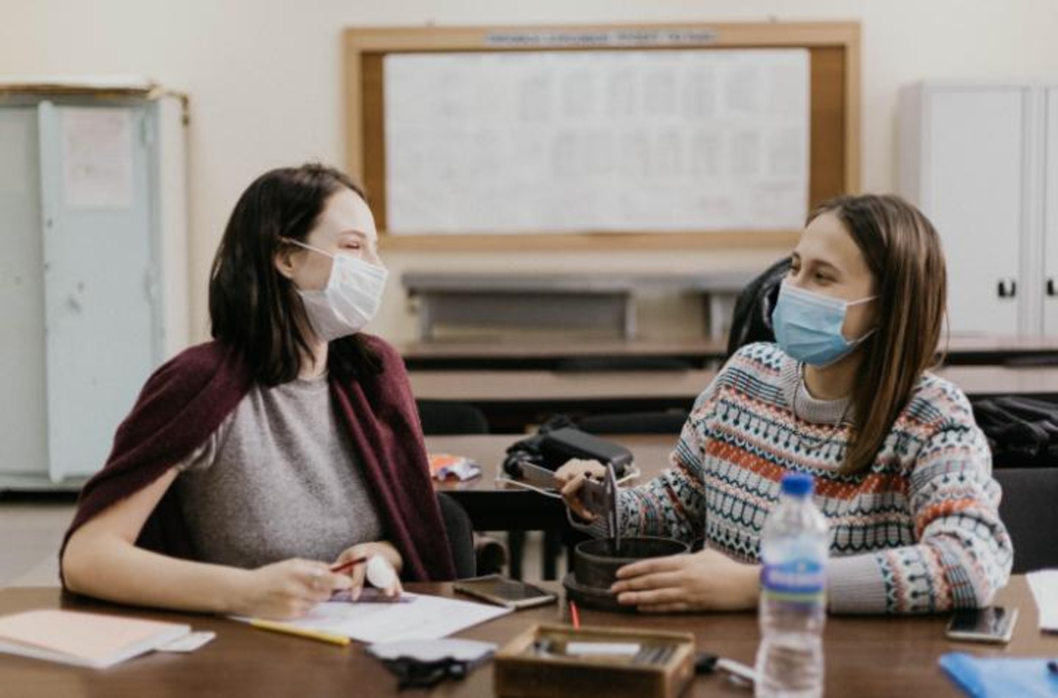 two female students with face masks on