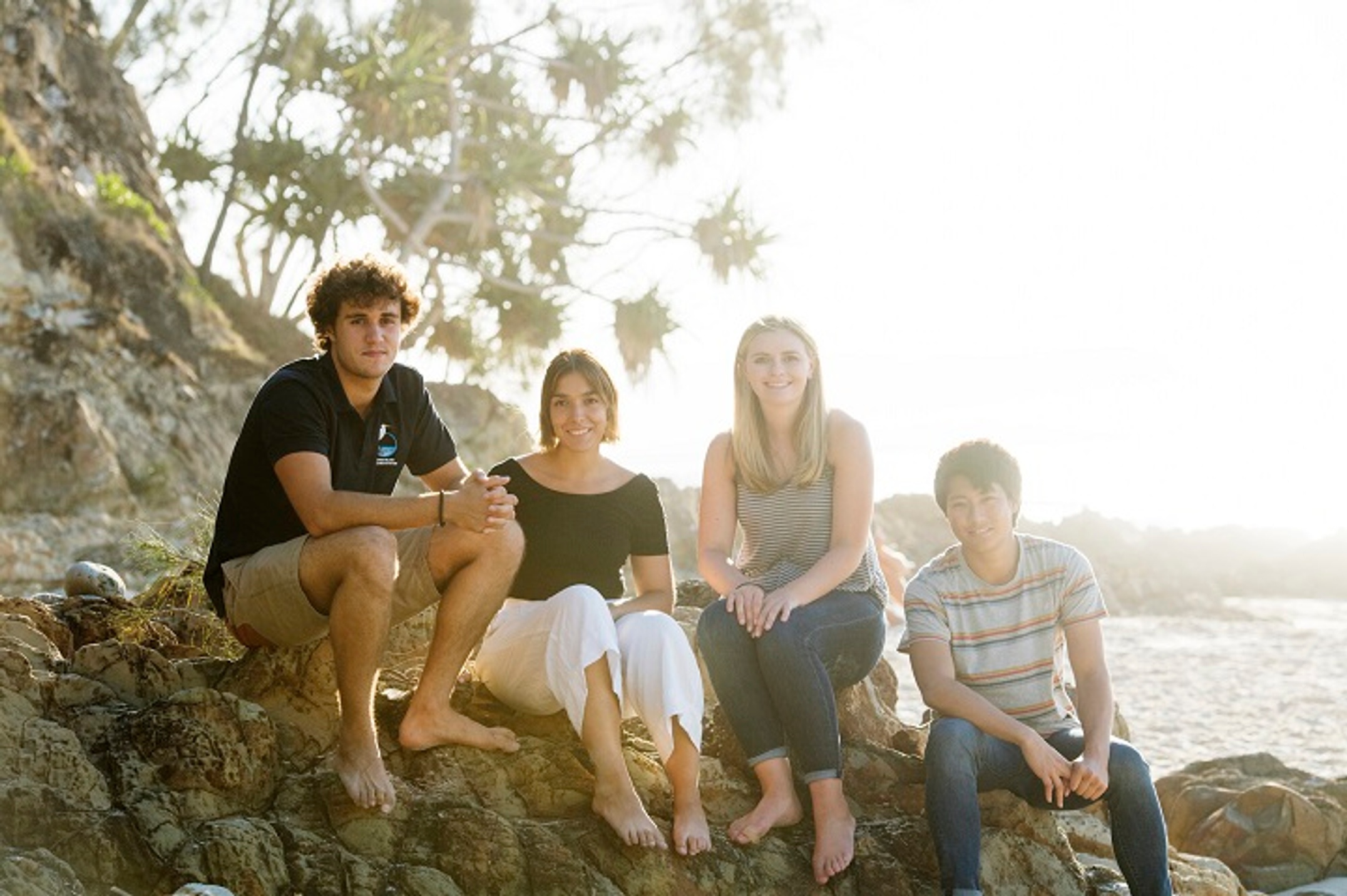 Group of students sitting at the beach