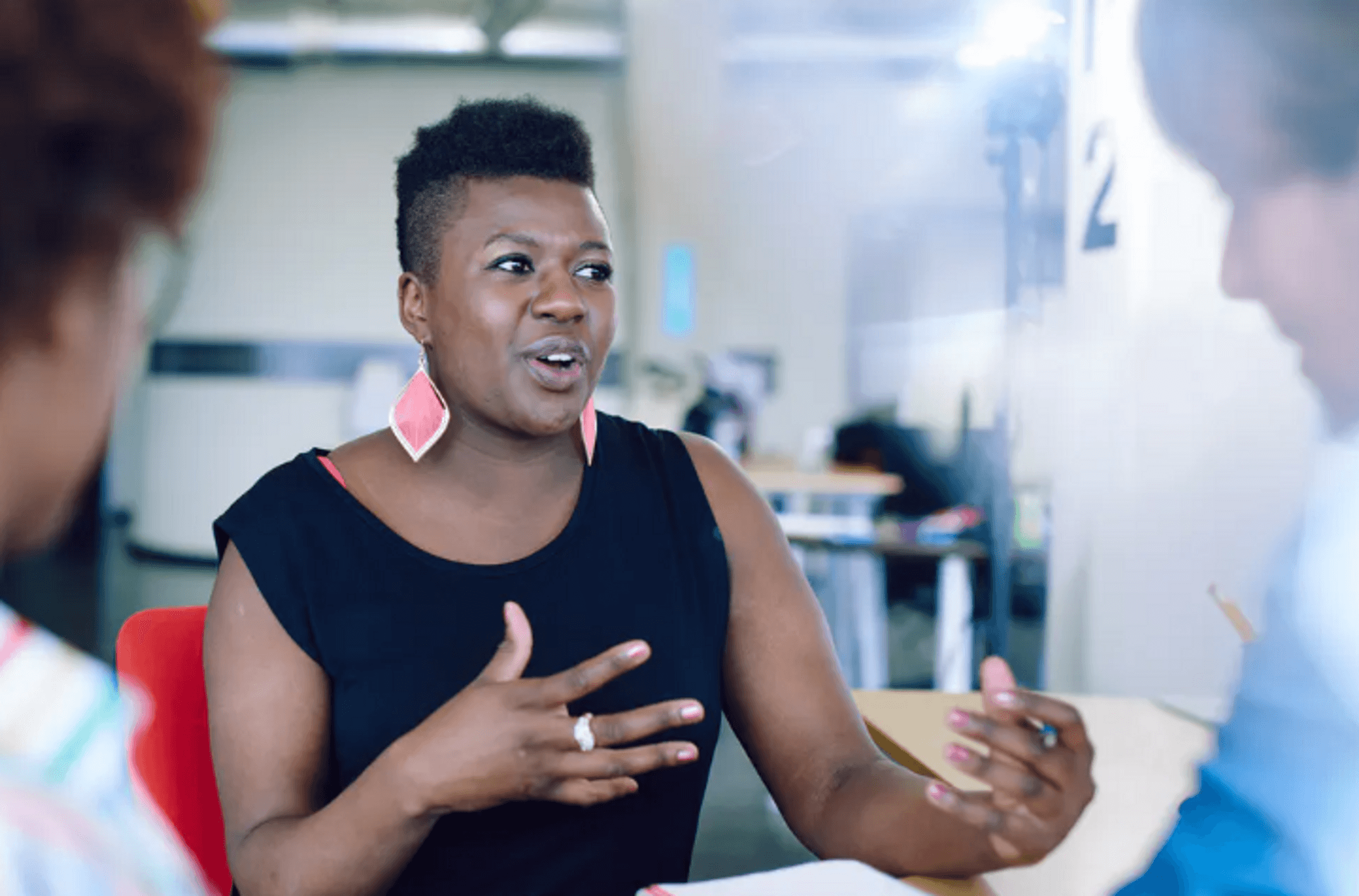 Black African woman talking to other people
