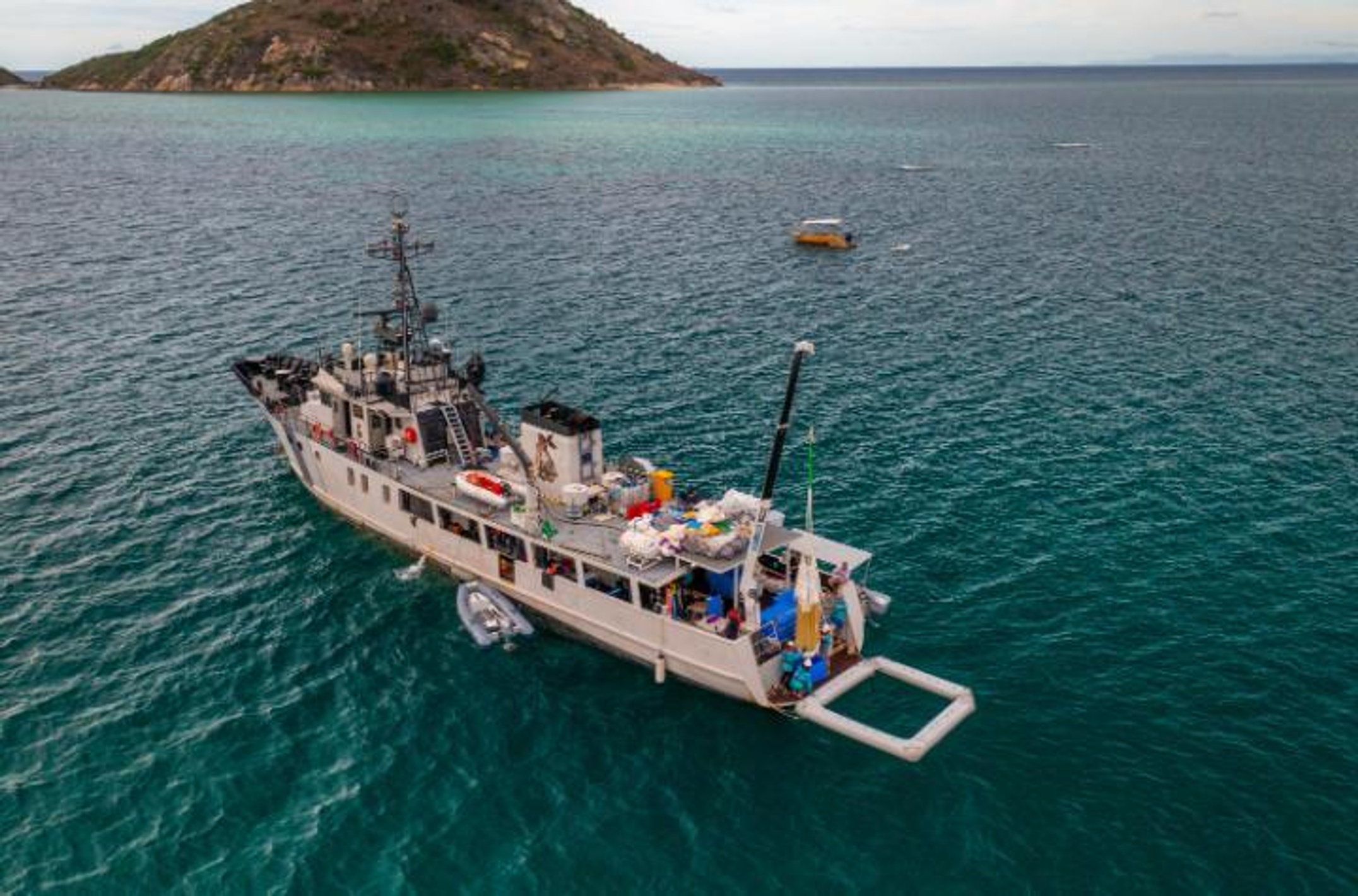 A large ship with floating pools on the ocean