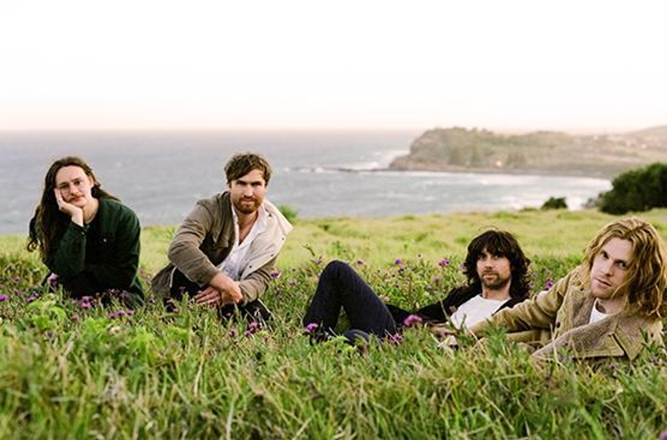 men sitting on headland