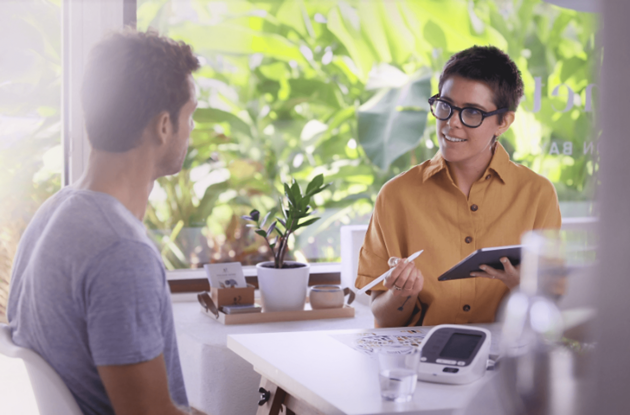 A woman explaining information to a man