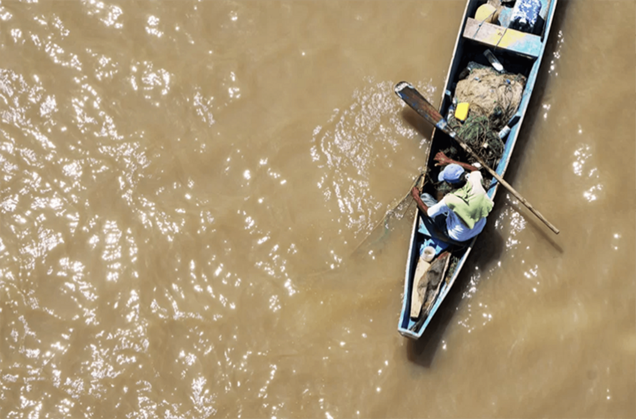 Fisherman in river