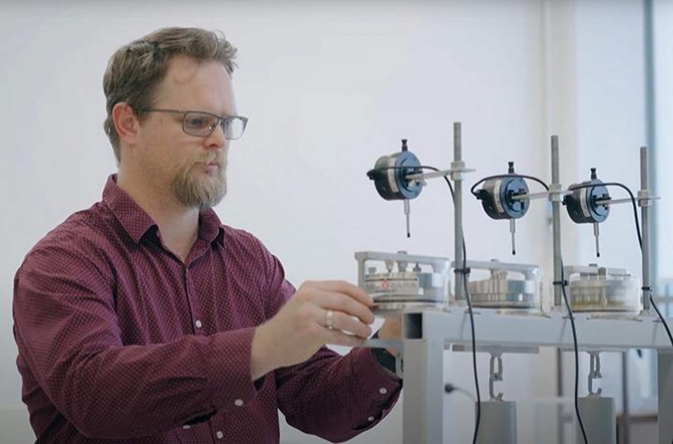 A man adjusting instruments in a laboratory