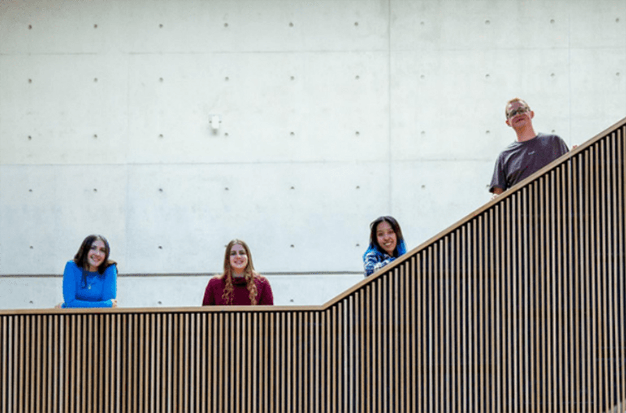 Students on stairs in library