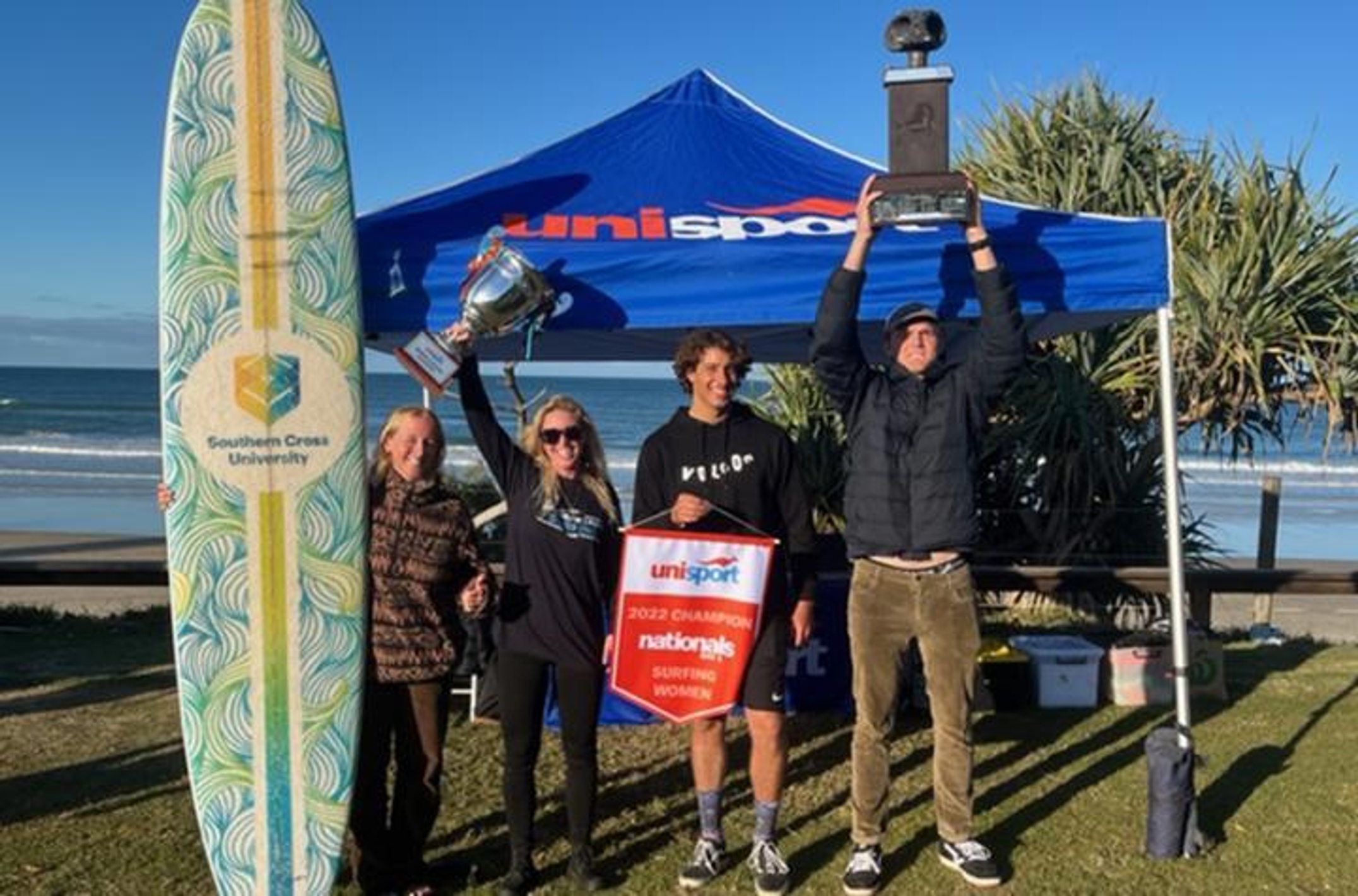 Surfing Team SCU winners with trophy