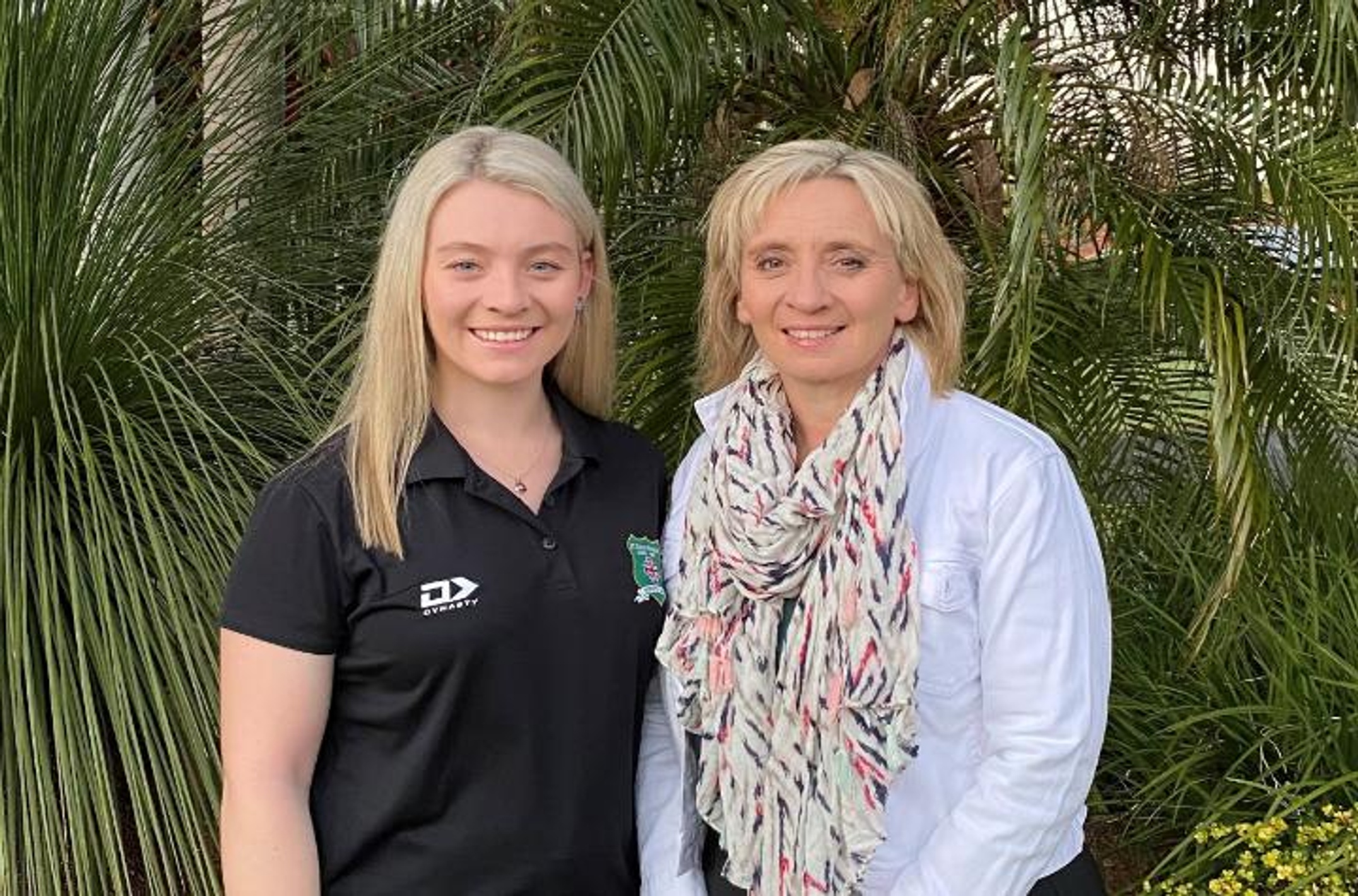 Daughter and mother, Maddie (left) and Rose (right) Smith, standing in front of a garden.