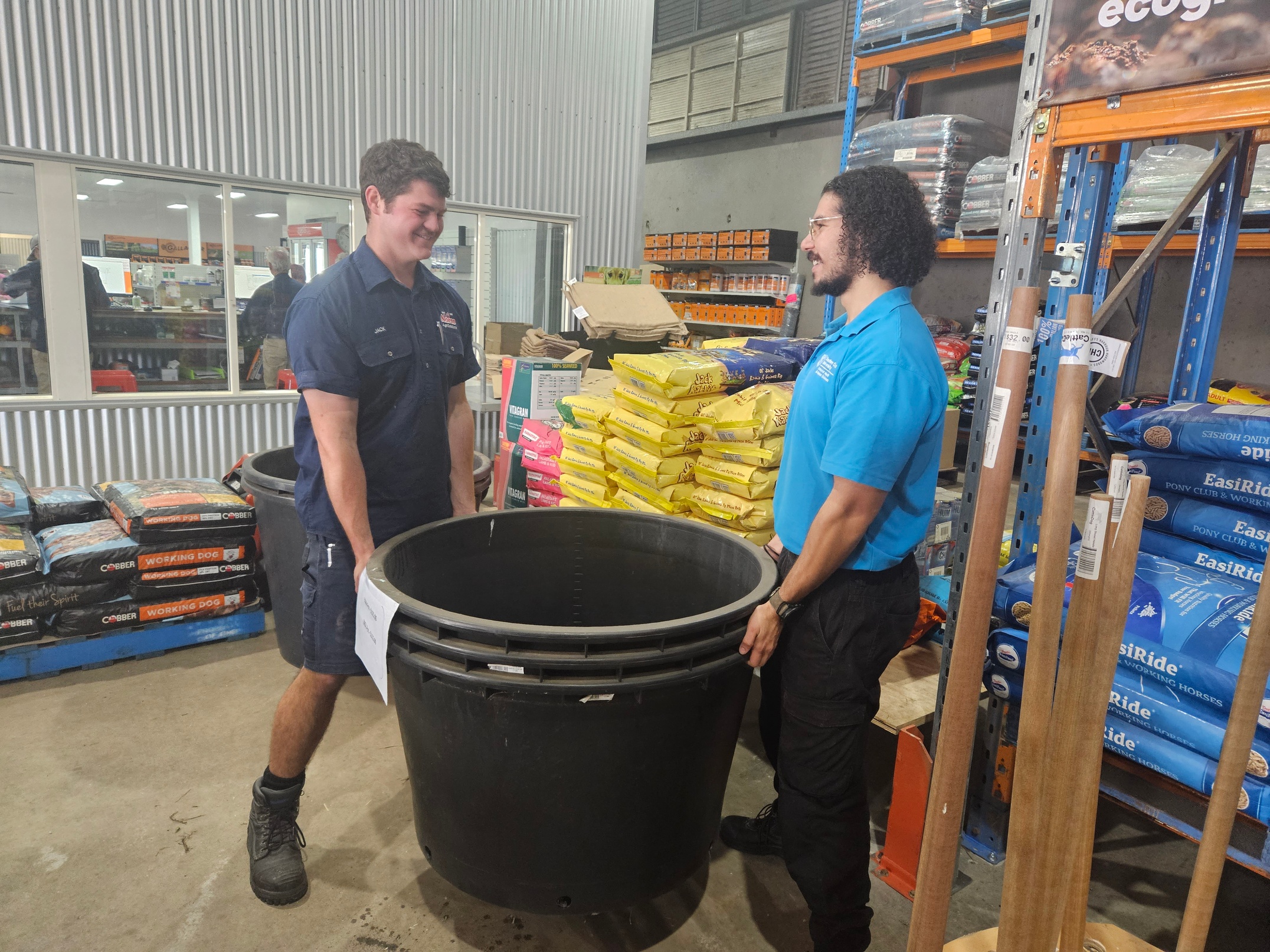 Norco worker Jack Conroy does two-person lift with OT student Jerome Tadros