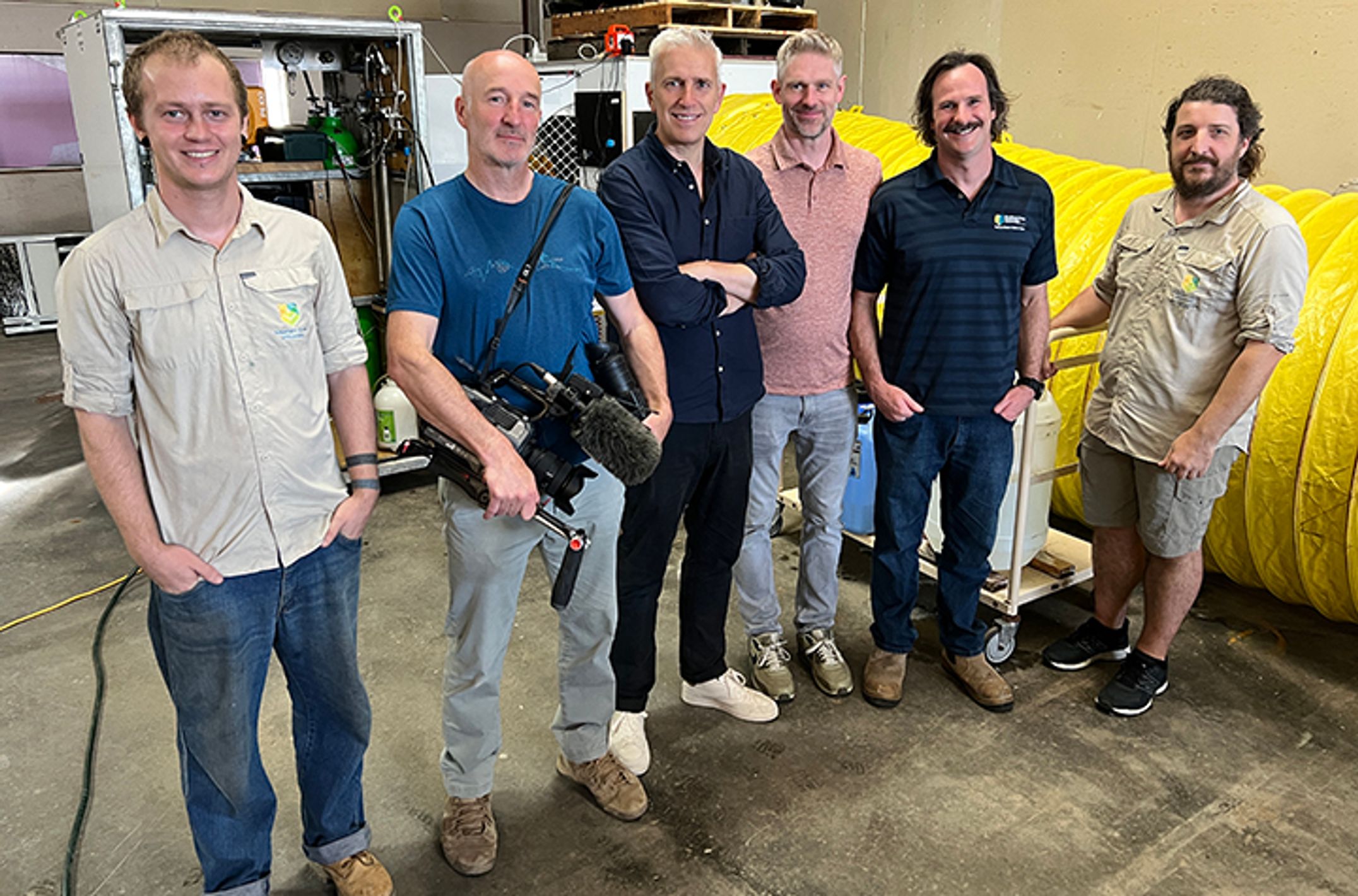 A group of men in a research facility