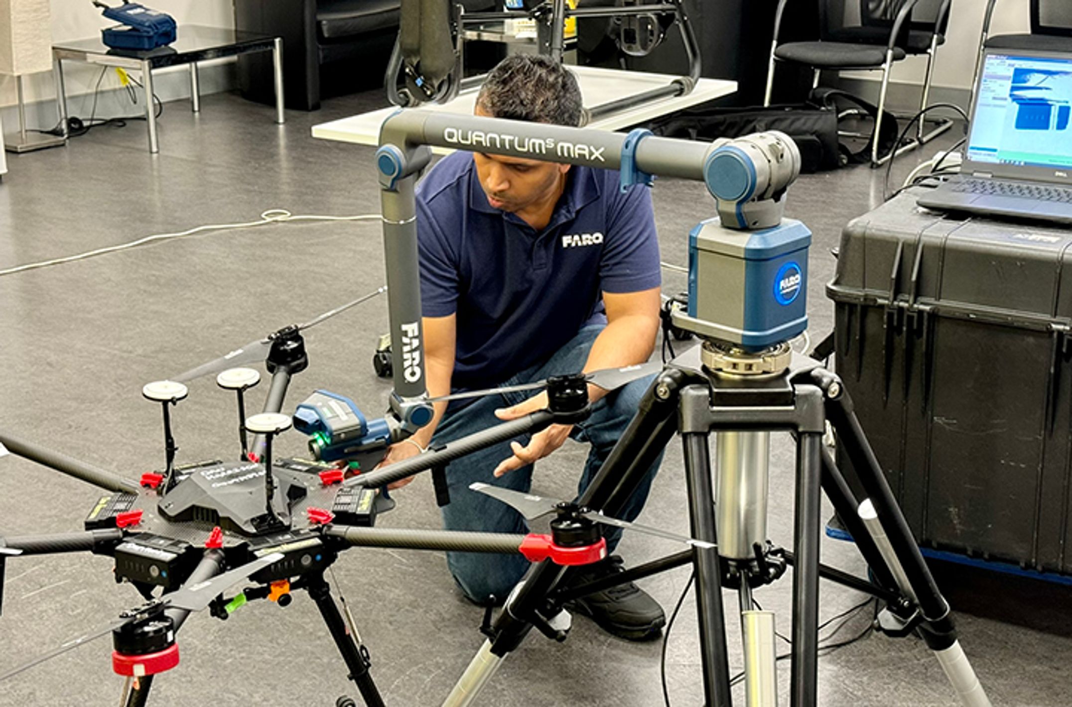 A man using special equipment to created a 3D scan of a drone