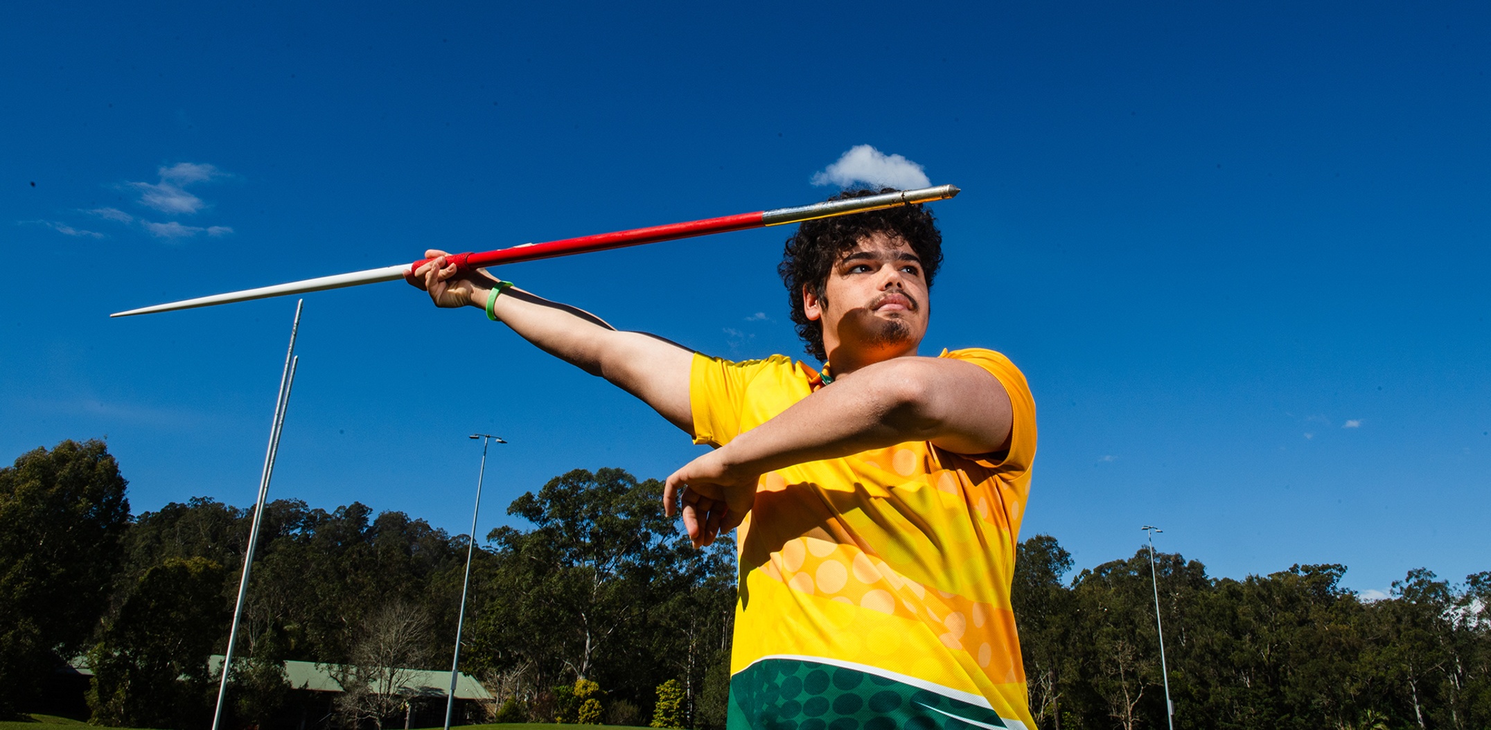 A student holding a javelin