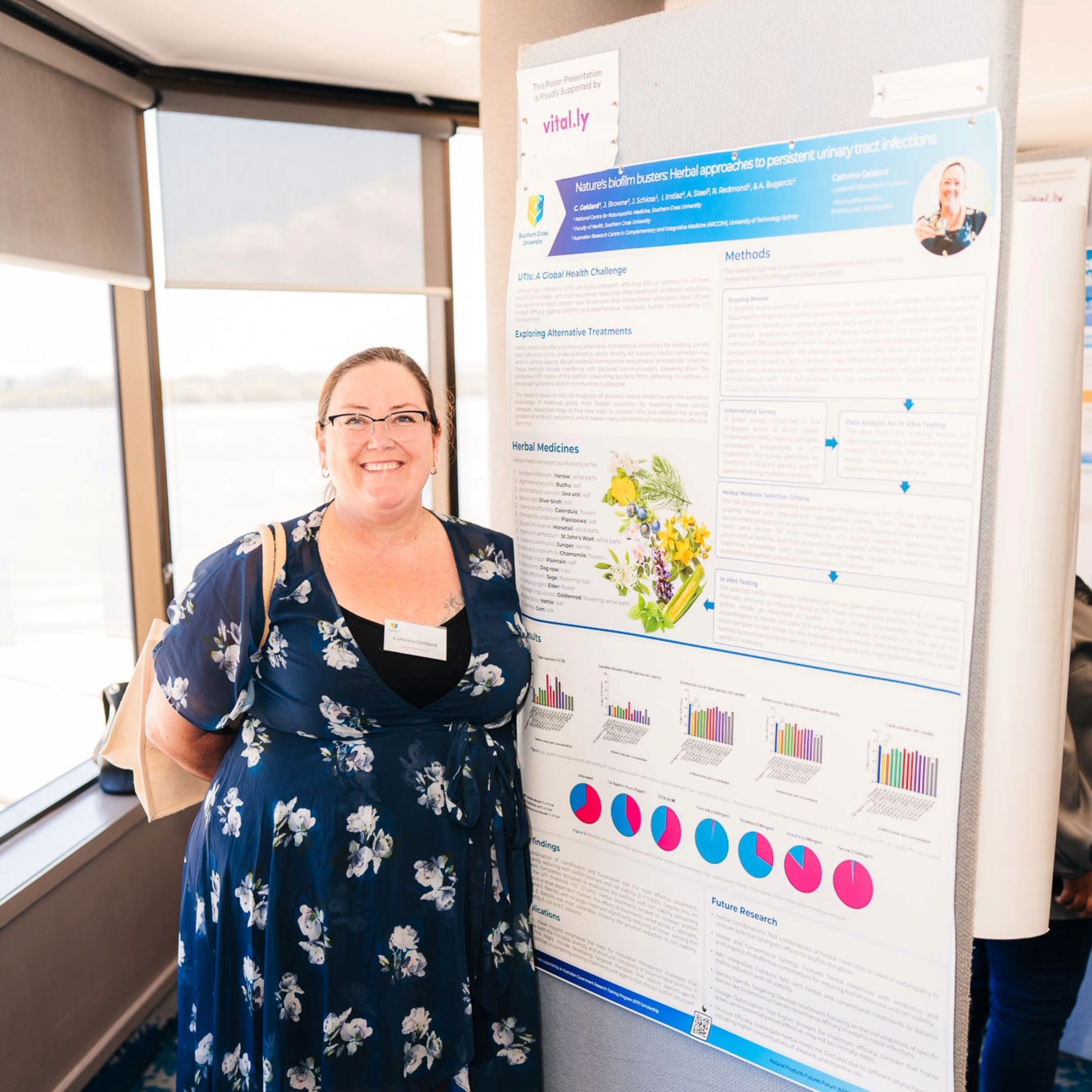 PhD student presenting a poster
