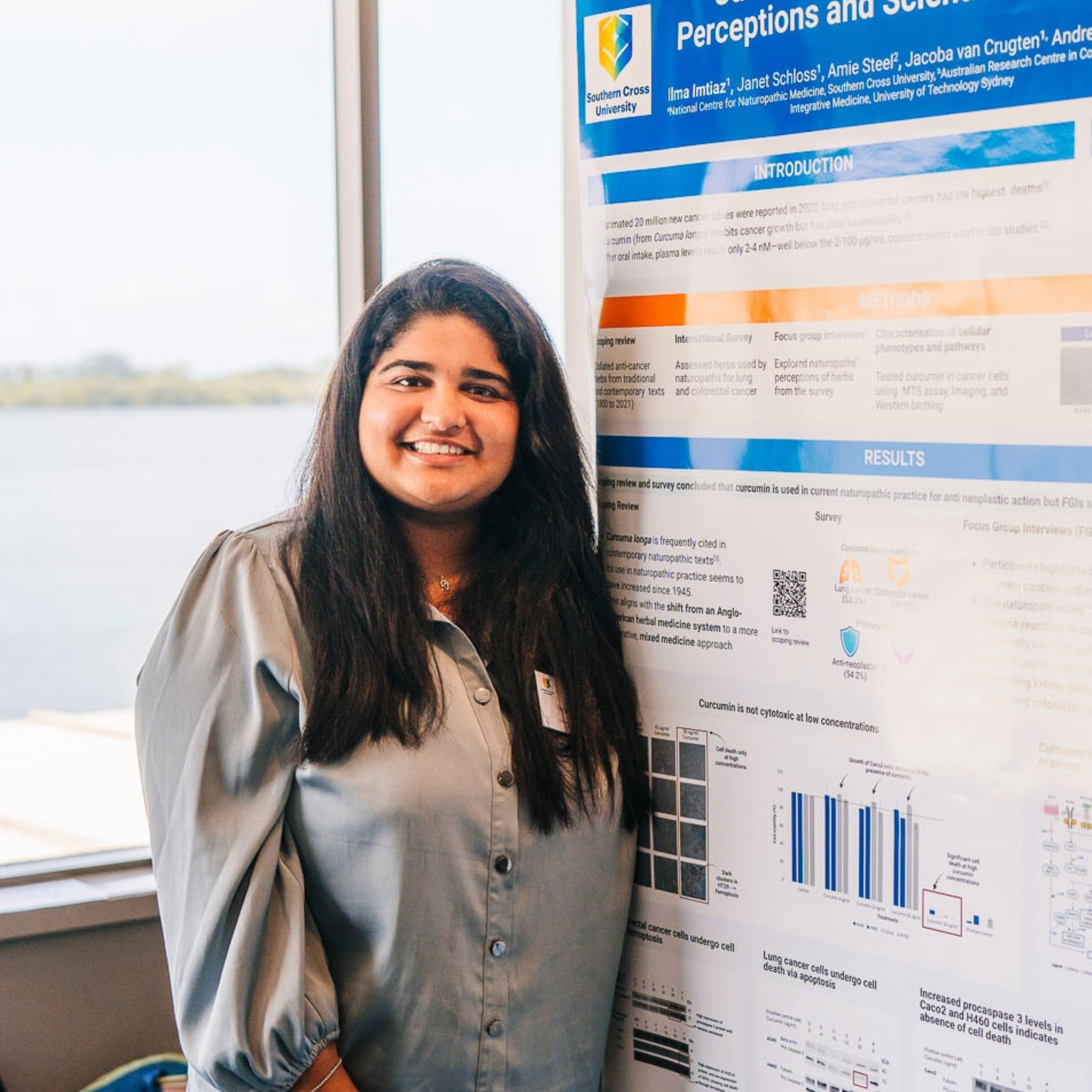 PhD student presenting a poster