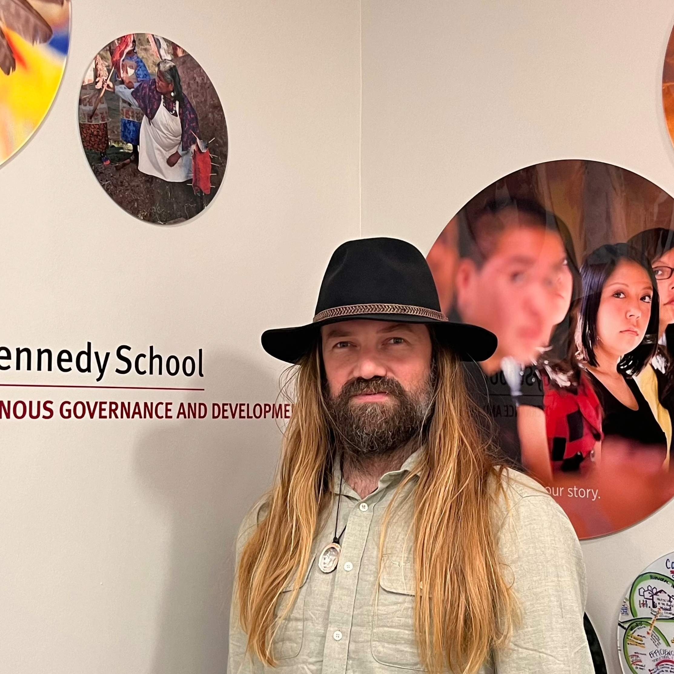 Man in a hat with long hair and a beard