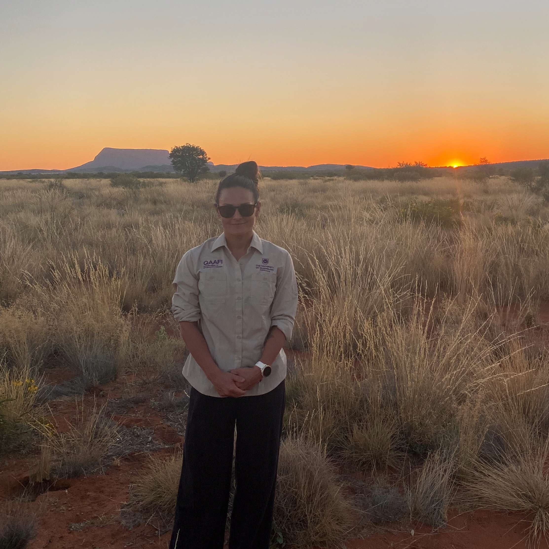 Woman in sunglasses in a desert