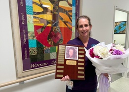Midwife Renay James holds her Dorothy Edwards Scholarship award