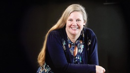 Woman smiling with black background