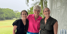 Three women smiling at camera