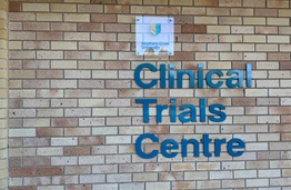 A brick facade with signage saying Clinical Trials Centre