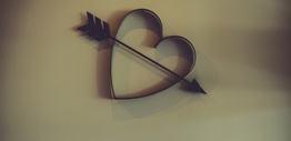 Metal cupid heart with arrow on wall