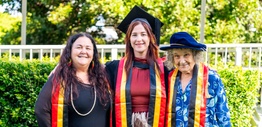 Three women in graduation robes