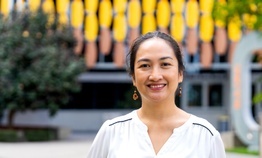 A woman smiling at the camera