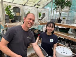 A man and a woman in an open laboratory setting