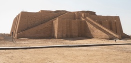 Large stone structure sitting in the middle of a desert