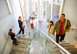 Students walking up a staircase on the Gold Coast campus