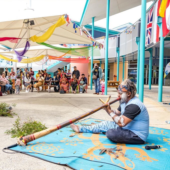 Elder playing didgeridoo