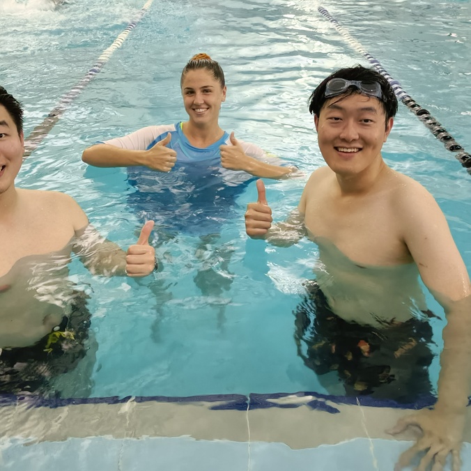 Students in water at learn to swim program